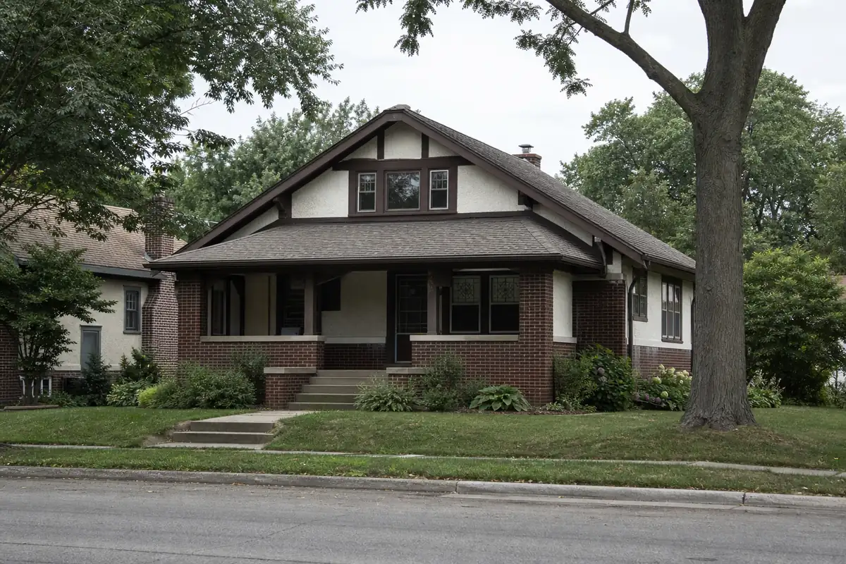 A 1920s brick-and-stucco Tudor-influenced bungalow on a mature tree-lined street — we buy houses wauwatosa — Cudahy, WI